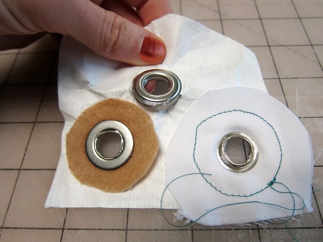 Setting corner grommets on a homemade tent footprint with a grommet kit