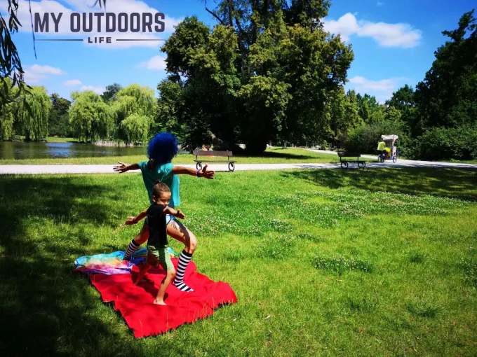 My wife and son practicing yoga outside