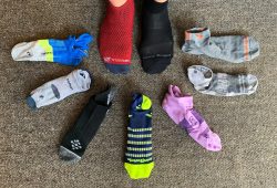 Selection of the best running socks laid out with running shoes