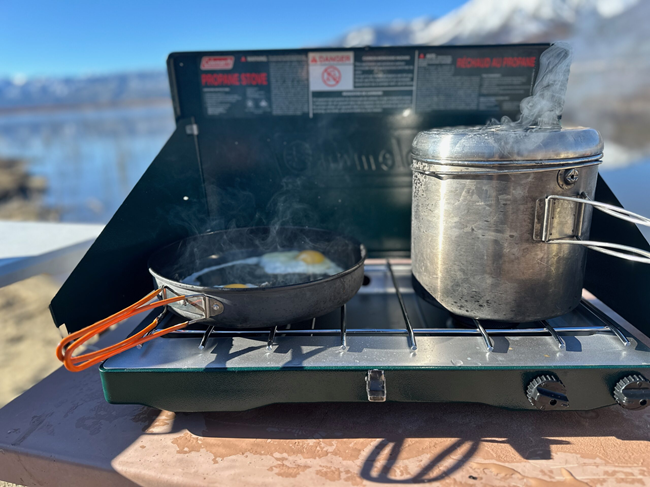 camping stove being used for cooking